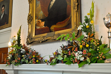 An arrangement in the Old Governor's Office designed by Boxwood Garden Club.